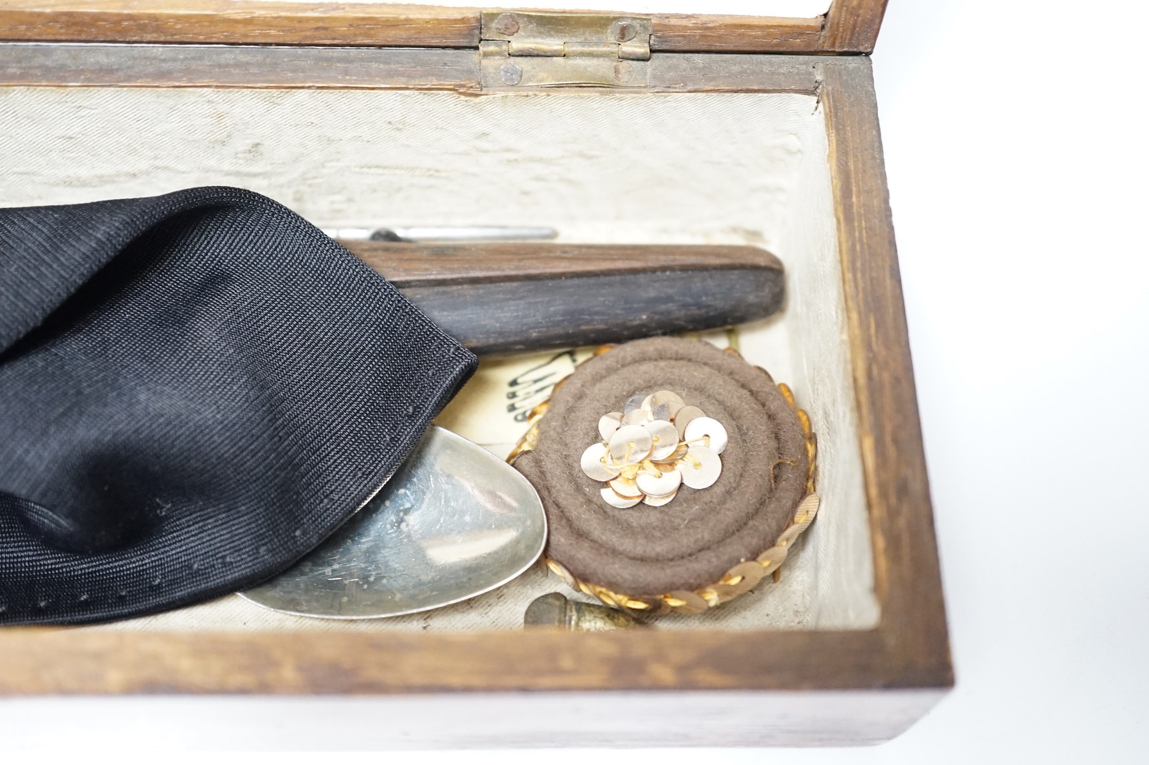 A glove box containing a boxwood foot-measure, two candle snuffers, a silver teaspoon etc